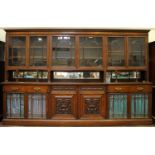 A large Edwardian rosewood glazed bookcase, from Harrods Walter Carter of Manchester, the top with