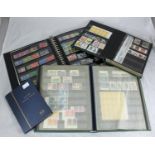 A collection of assorted GB and world stamps across four albums, predominantly ERII, some used, some