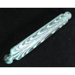 A Victorian Nailsea style glass rolling pin with opaque white swirled design, approx. 40cm long