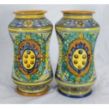 A pair of 20th century Italian Maiolica pottery jars of waisted form, typically decorated in