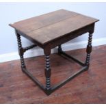 A late 17th C oak table of rectangular form, on bobbin-turned supports to plain stretcher, 81cm wide