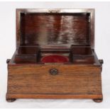 A 19th century rosewood tea caddy of sarcophagus form, with wooden handles at either end, raised