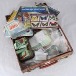 A collection of assorted cigarette and tea cards comprising a number of Brooke Bond books,