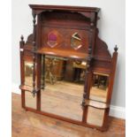 An Edwardian stained over-mantel mirror, the top section with two hexagonal shaped mirrors above