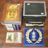 A collection of cigarette cards, silks and postcards including WW1, in five photograph albums,