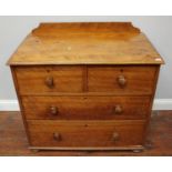 A Victorian faded walnut chest of drawers, raised back, two short above two long drawers with turned