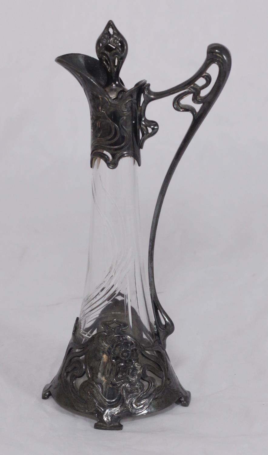 An Art Nouveau WMF glass jug and stopper, the silver-plated mounts modelled with two maidens