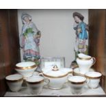SECTION 24. A 21-piece Aynsley 'Argosy' pattern part coffee set, a pair of pottery figures on