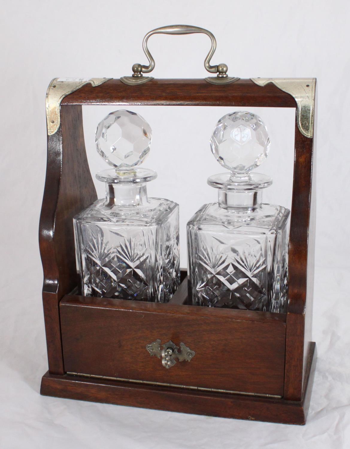 A two-decanter Tantalus with two Royal Doulton 'Georgian' pattern cut-glass decanters, of square