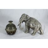 An Indian cast bronze elephant claw bell with engraved foliate decoration, together with a silver-