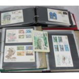 A collection of approximately 140 first day covers across four albums, some GB, Jersey, Isle of