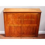 An early 20th century stained walnut upright chart or map chest, with hinged slope top and front,