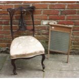 A stained mahogany child's chair, with pierced and carved back, cream, floral upholstered stuff-over