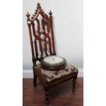 A Victorian stained oak nursing with pierced gothic tracery back and tapestry seat, together with