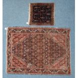 A hand-knotted rug, the center with stylized floral guls, to a geometric multi-border, 150 x