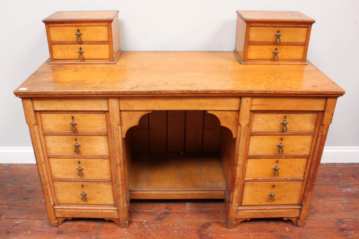 An oak pedestal desk with two miniature cupboards atop either side, the pedestals with four - Image 2 of 2