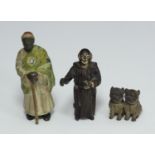 An early 20th century Austrian cold-painted pair of miniature pug dogs, 22mm, and monk (stamped