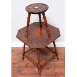 An Arts & Crafts design three-legged stool, with leaf carved decoration in the style of Alexander