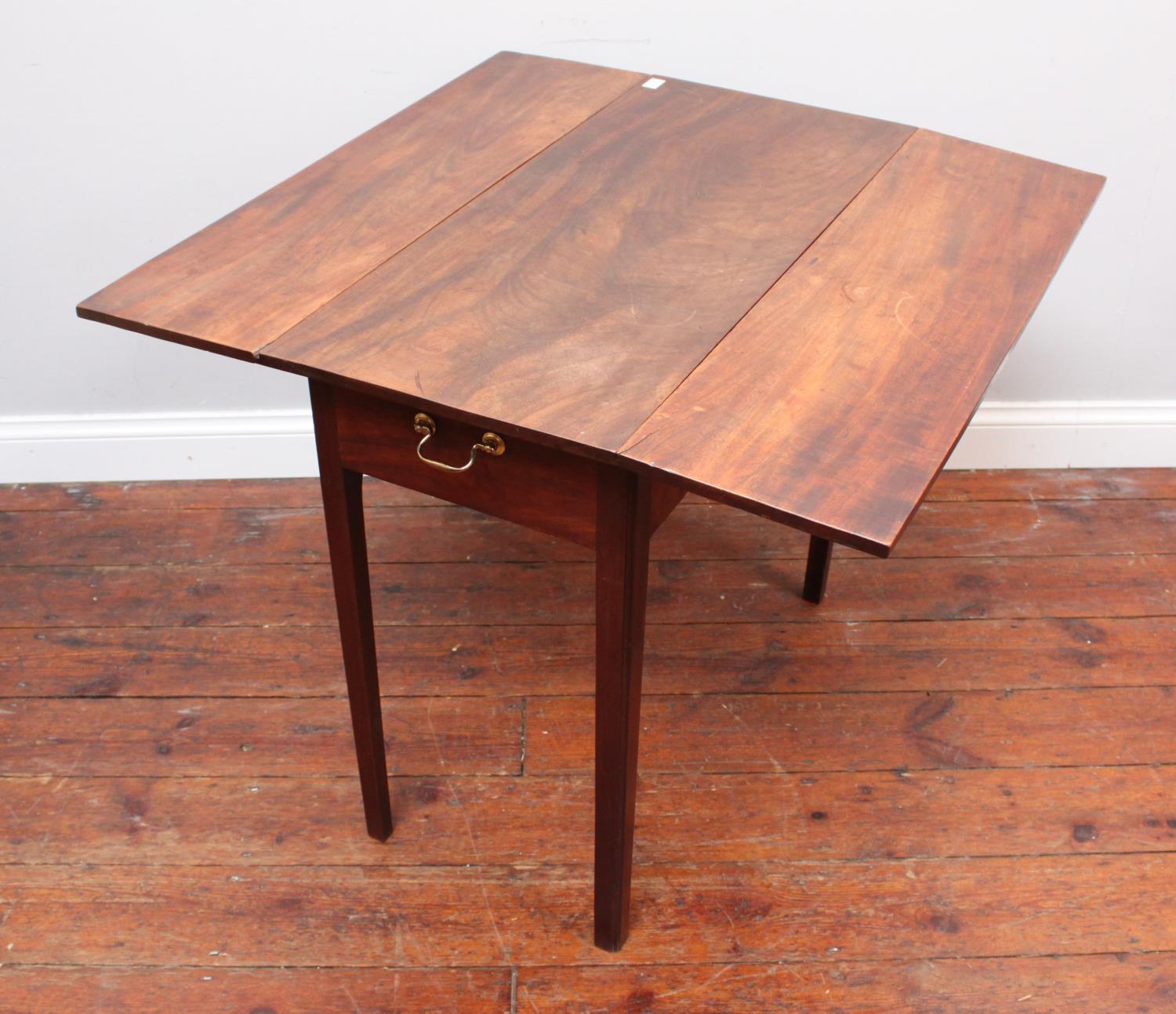A 19th century mahogany drop-leaf Pembroke table, with single frieze drawer and opposing faux