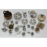 A collection of miniature ceramic and other items including a Grainger & Co 'bird painted' pot &