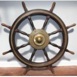 A large late 19th / early 20th century mahogany and brass-bound ship's wheel, 137cm