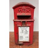 A George VI GPO red pole-mounted cast iron post box made by W T Allen & Co London, arched top, the