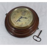 A 1920s/1930s ships' bulkhead clock with Arabic numerals, subsidiary seconds dial, in a circular