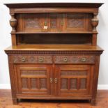 A good-quality 1920s oak court cupboard in the Tudor 'style' by Robson & Sons, Newcastle-on-Tyne,