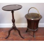 An early 20th century brass peat bucket with stained wood spindle stand, together with a stained