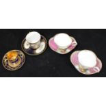 A pair of Meissen porcelain cabinet cups and saucers of quarter-foil shape and painted with courting