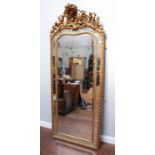 A 19th century gilt-framed pier glass mirror in the George II style, with central large bevelled