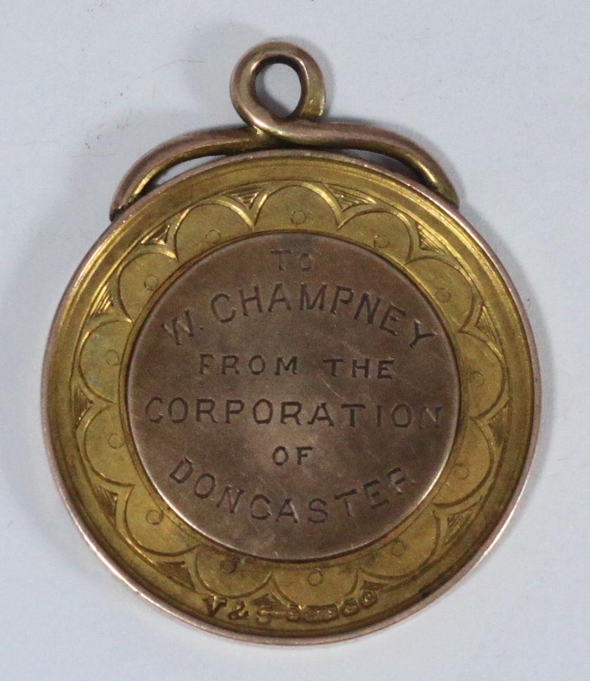 A 9ct gold Boer War medal, 'South Africa War 1900-01,' with enamelled decoration to the obverse,