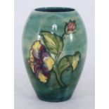 A Moorcroft pottery vase of ovoid form, decorated in the 'Hibiscus' pattern to green and blue