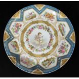 A 19th century Sevres porcelain cabinet plate, painted to the centre with a cherub, within garland