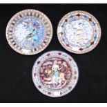 Three 19th century Persian/Ottoman pottery wall plates, each tin-glazed and decorated in blue, mauve