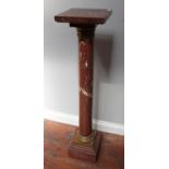 A Victorian rouge marble torchere stand with square top, plain turned column with gilt-metal capital