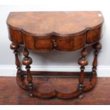 An early 20th century Dutch walnut side table, shaped top with single oak-lined drawer, and turned