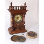 An early 20th century German Symphonion mantel Clock, together with 11x Junghans steel discs,