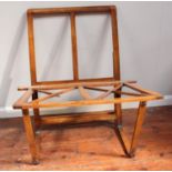 An Edwardian stained walnut hinged and folding folio stand, 110cm wide (one diagonal brace