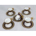 SECTION 31. A set of five Vienna coffee cups and saucers, decorated in a blue and gilt design