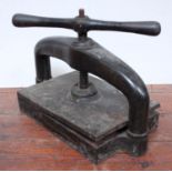 A heavy cast iron Lion book press with lion emblem, screw handle, the plate size approx. 38 x 35cm