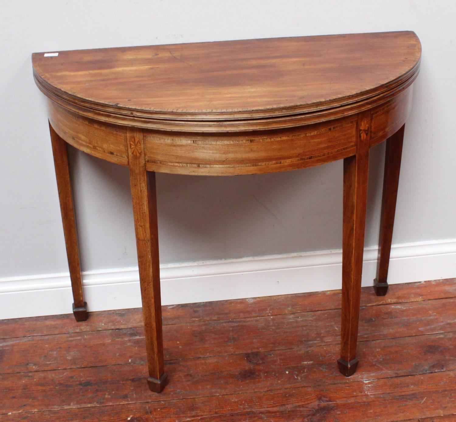 A George III mahogany and cross-banded demi-lune folding tea table with gate-leg square tapering - Image 2 of 2