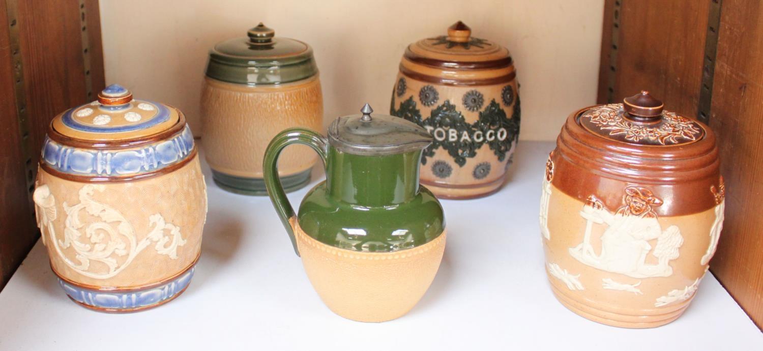 SECTION 21. Two various Royal Doulton and two Doulton Lambeth stoneware tobacco jars and covers,