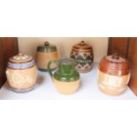 SECTION 21. Two various Royal Doulton and two Doulton Lambeth stoneware tobacco jars and covers,