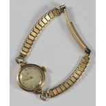 A ladies 9ct gold cased Omega cocktail watch, with circular case, silvered dial with Arabic