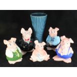 A set of five graduated Wade NatWest piggy banks with stoppers, (one with chipped ear), together