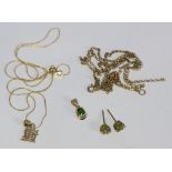 A 9ct gold necklace with 14ct gold fine chain, a pair of 9ct gold earrings with emerald coloured