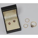 An 18ct gold, diamond and ruby ring together with a pair of 9ct gold, diamond and ruby earrings,