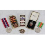 A WWII war medal and a Defence medal, together with a small collection of assorted safe driving