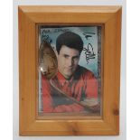 A Uri Geller 'bent spoon' inscribed to Simon with signed photo in glazed display frame, approx.